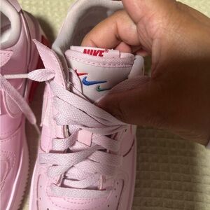 Nike Kids Pink Low-Top Sneakers with Multi-Color Swoosh